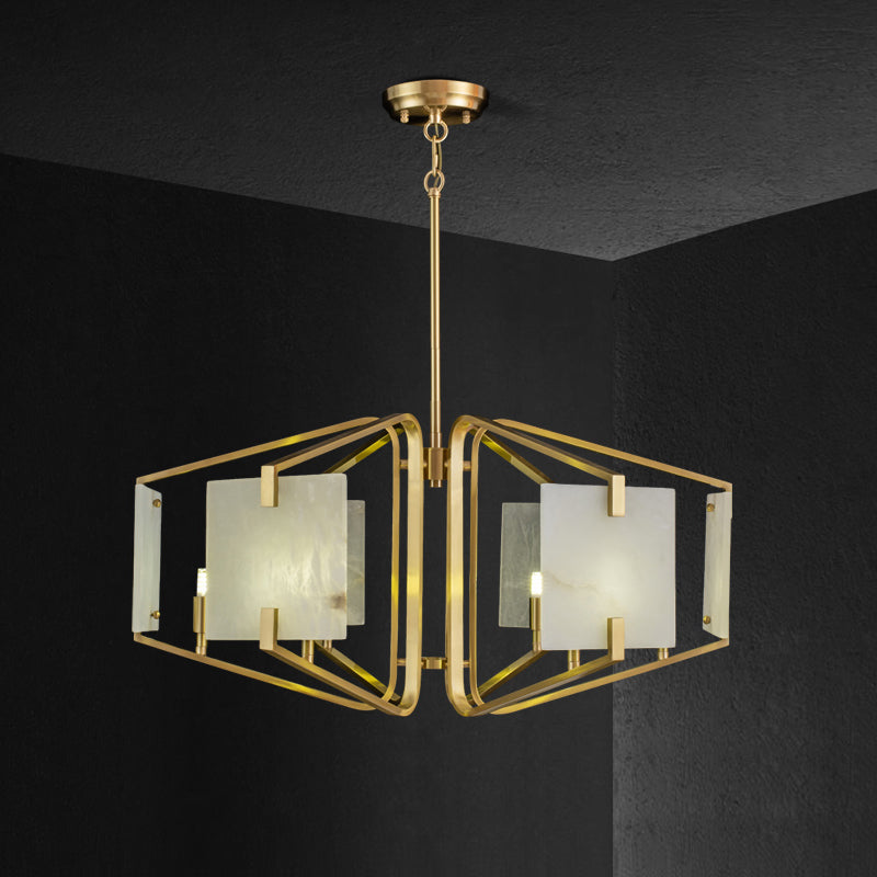 The Clérachic chandelier in its six-light width, brass arms splayed low with alabaster panels lit from within.