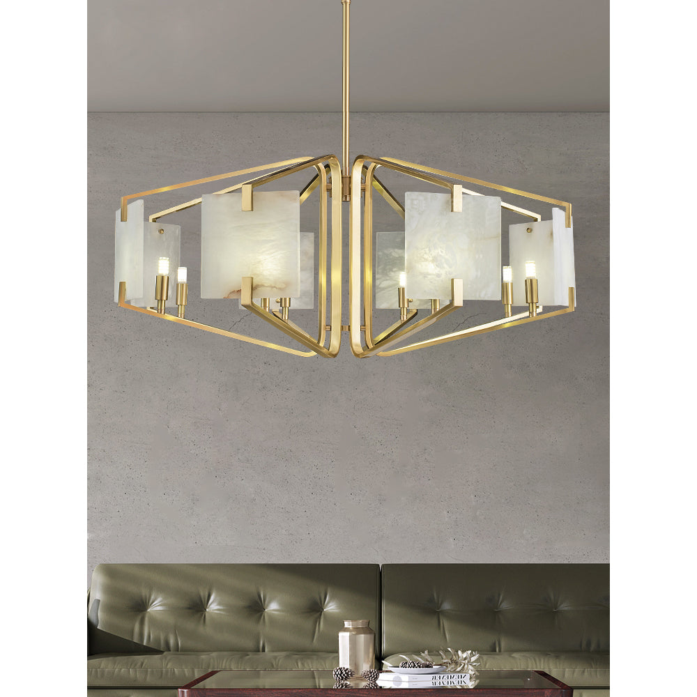 The Clérachic chandelier over a dark leather sofa, alabaster veining visible against the grey wall behind.