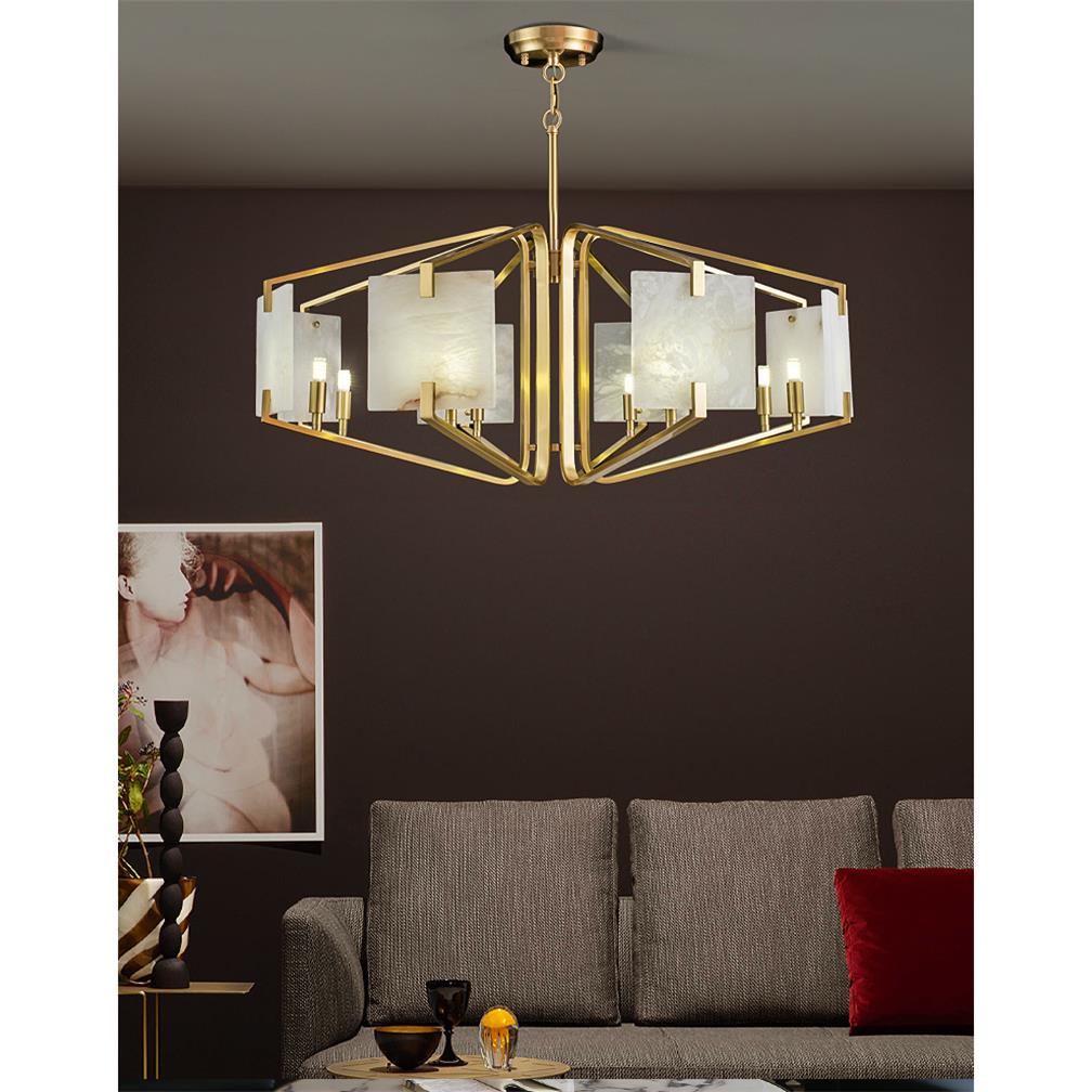The Clérachic chandelier lit above a beige sofa, brass frame warm against a deep aubergine painted wall.