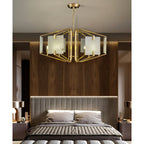 Clérachic chandelier in a bedroom, hung above a channel-tufted headboard and walnut panelled wall.