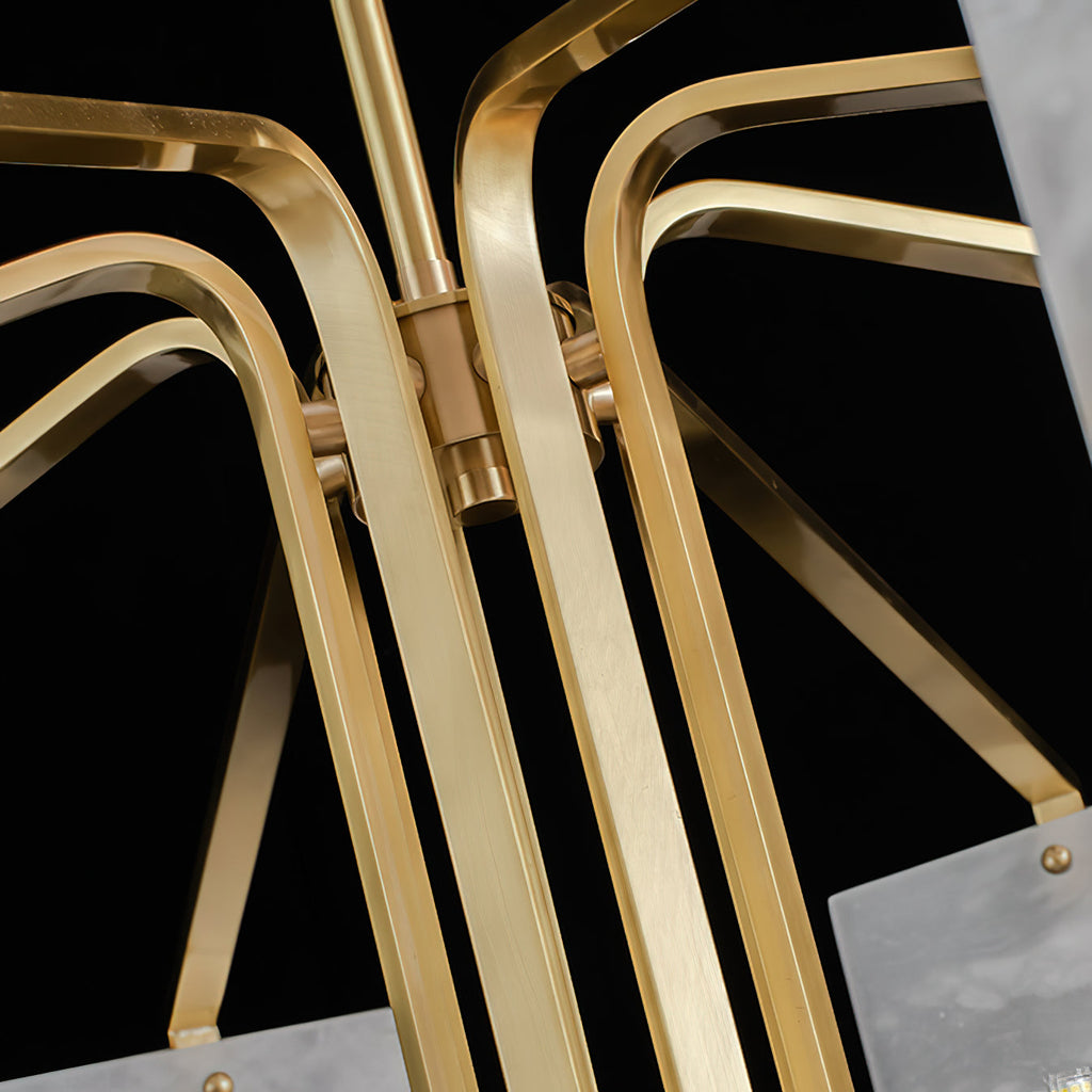 Macro of the Clérachic chandelier's brass bar junction, showing the machined connector and fixing screw.