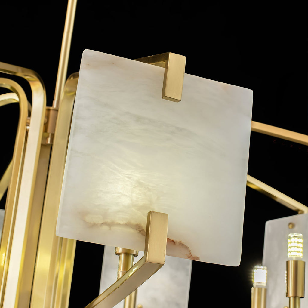 Detail of the Clérachic chandelier's panel corner in its brass bracket, with a G9 socket alongside it.