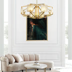 Clérachic chandelier in a white panelled room, hung above a curved cream sofa and round marble table.