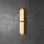 The Clérachic Lustra glowing warmer against troweled concrete, light spilling from the faceted tips of the stone.