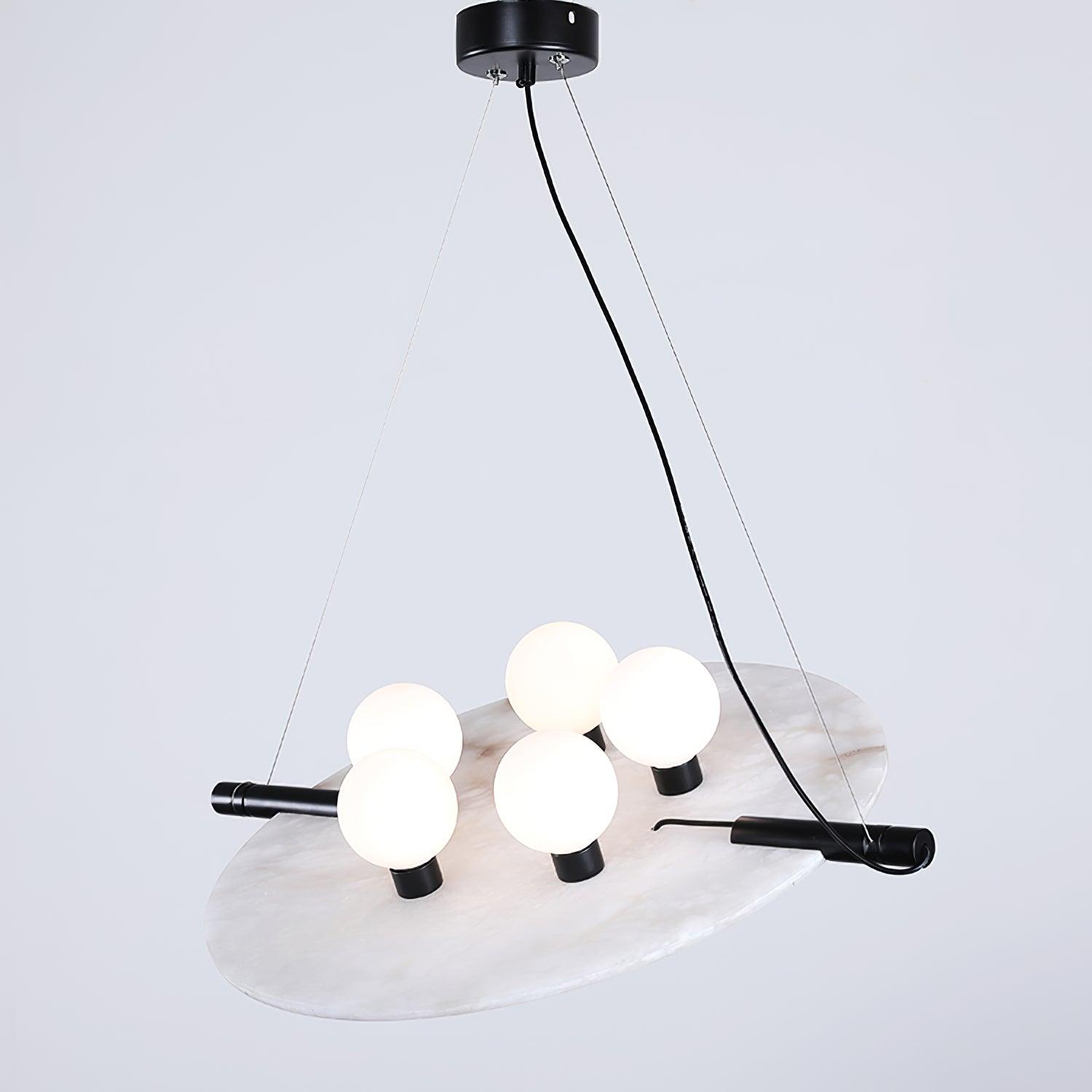 Clérachic Magma pendant, five opal globes set along a black bar across a natural alabaster disc.
