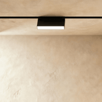 Clérachic box floodlight, a low black housing on the rail with a lit panel across its underside.