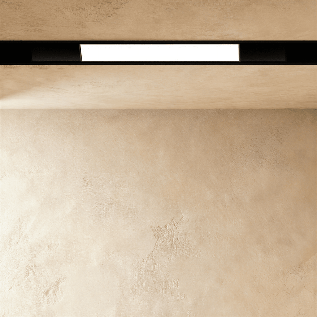 Clérachic recessed light bar, a lit panel set inside the black channel, which runs on unlit at both ends.