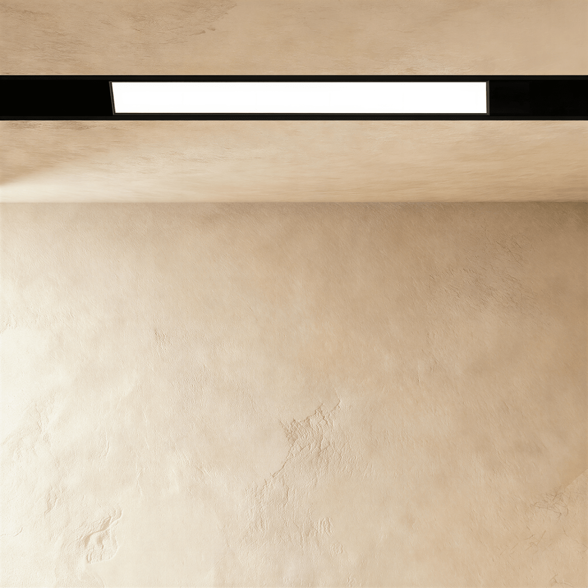 Clérachic recessed light bar along a limewashed ceiling, the lit panel framed in black above and below.