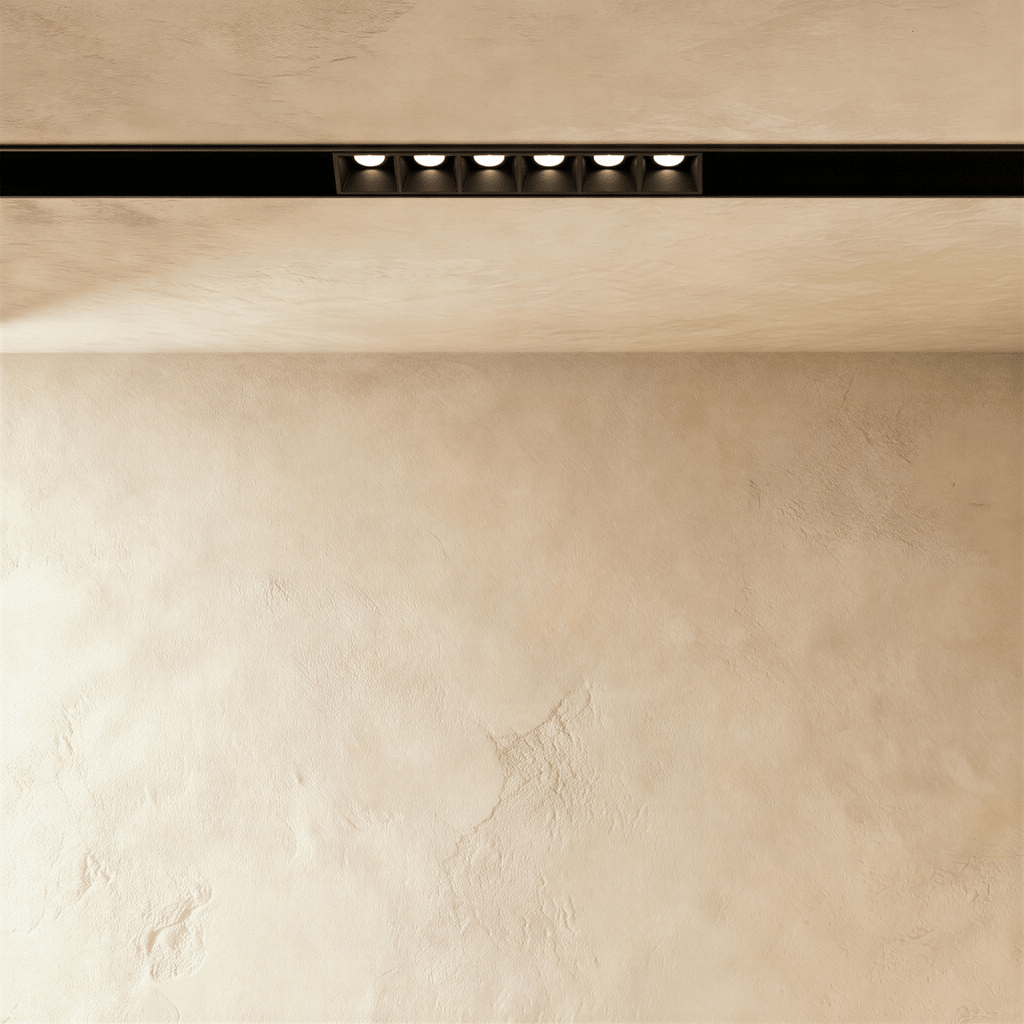 Clérachic recessed grille head, six round lenses set flush in the channel, each throwing its own beam.