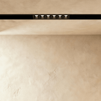 Clérachic recessed grille head, six round lenses set flush in the channel, each throwing its own beam.