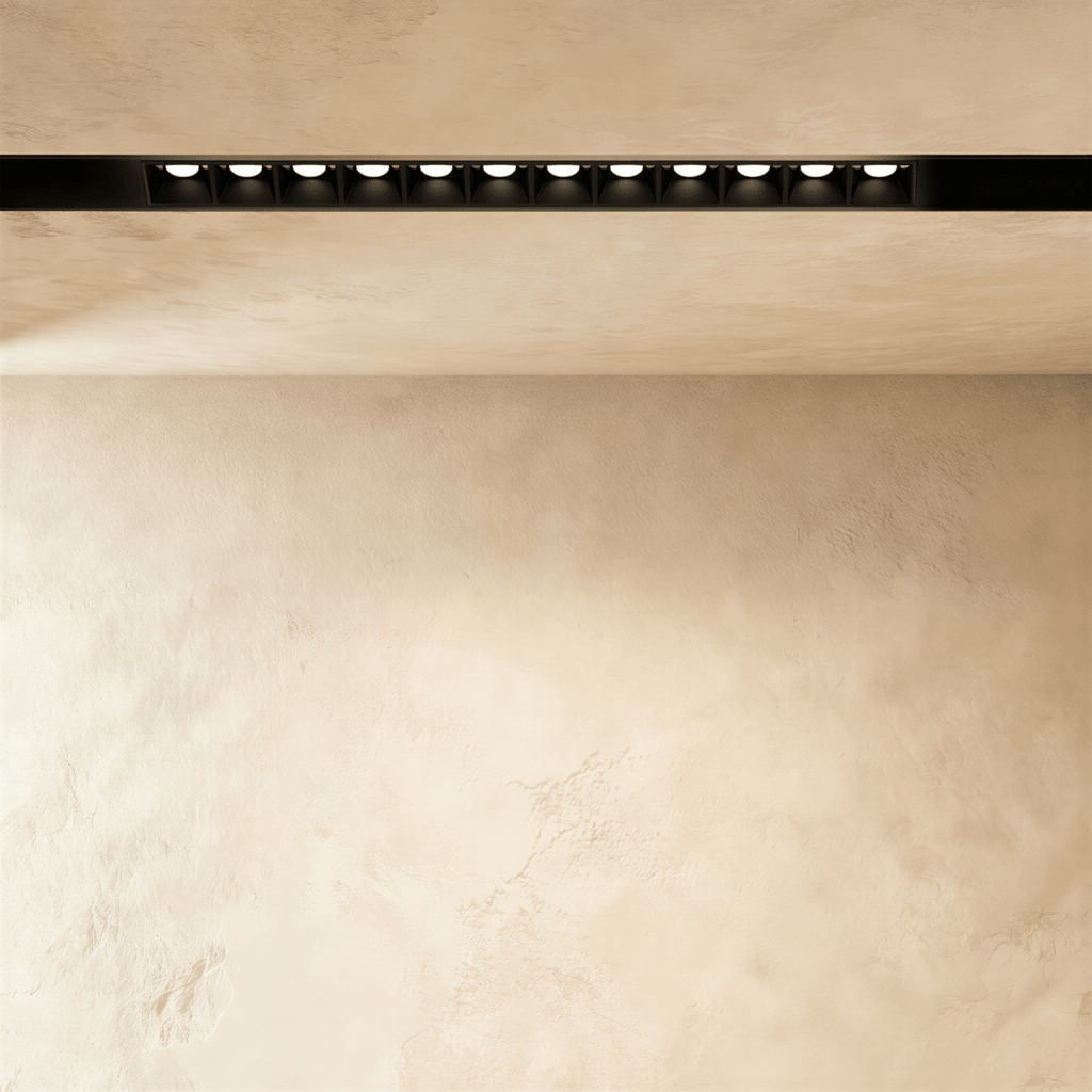 Clérachic recessed grille head in a longer size, a row of round lenses running along the black channel.