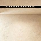 Clérachic recessed grille head in a longer size, a row of round lenses running along the black channel.