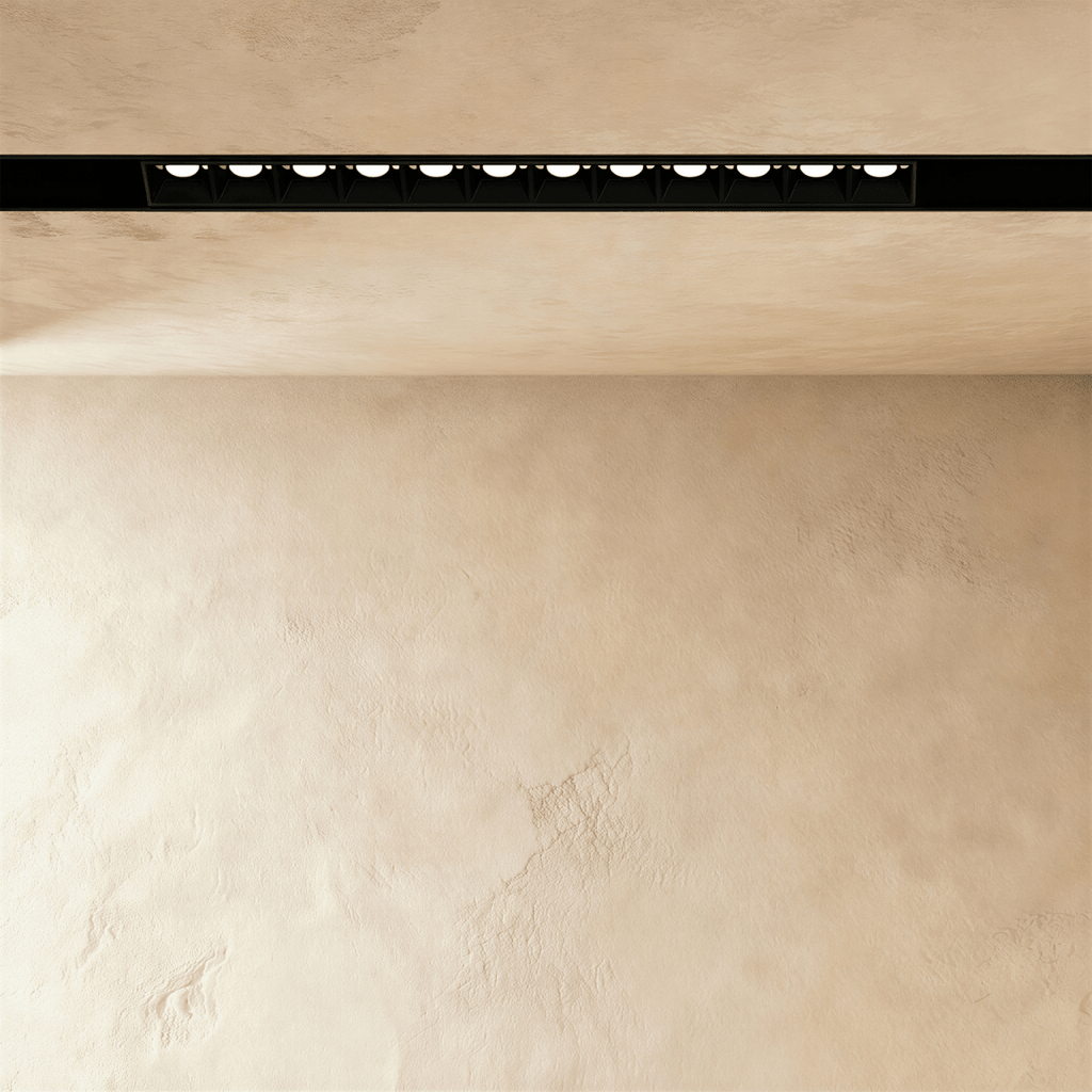 Clérachic recessed grille head shown close, the lit lenses separated by black baffles down the channel.