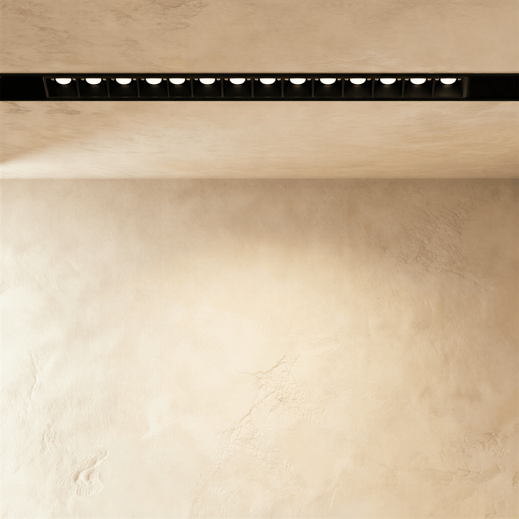 Clérachic recessed grille head at full length, the row of lenses reaching almost edge to edge in the frame.