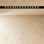 Clérachic recessed grille head, a long row of round lenses sitting flush inside the black channel.