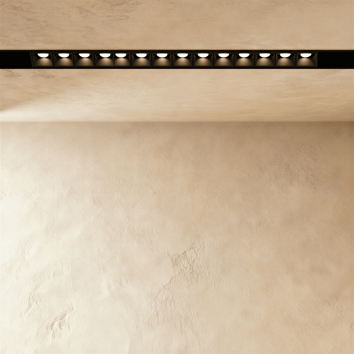 Clérachic recessed grille head, a long row of round lenses sitting flush inside the black channel.