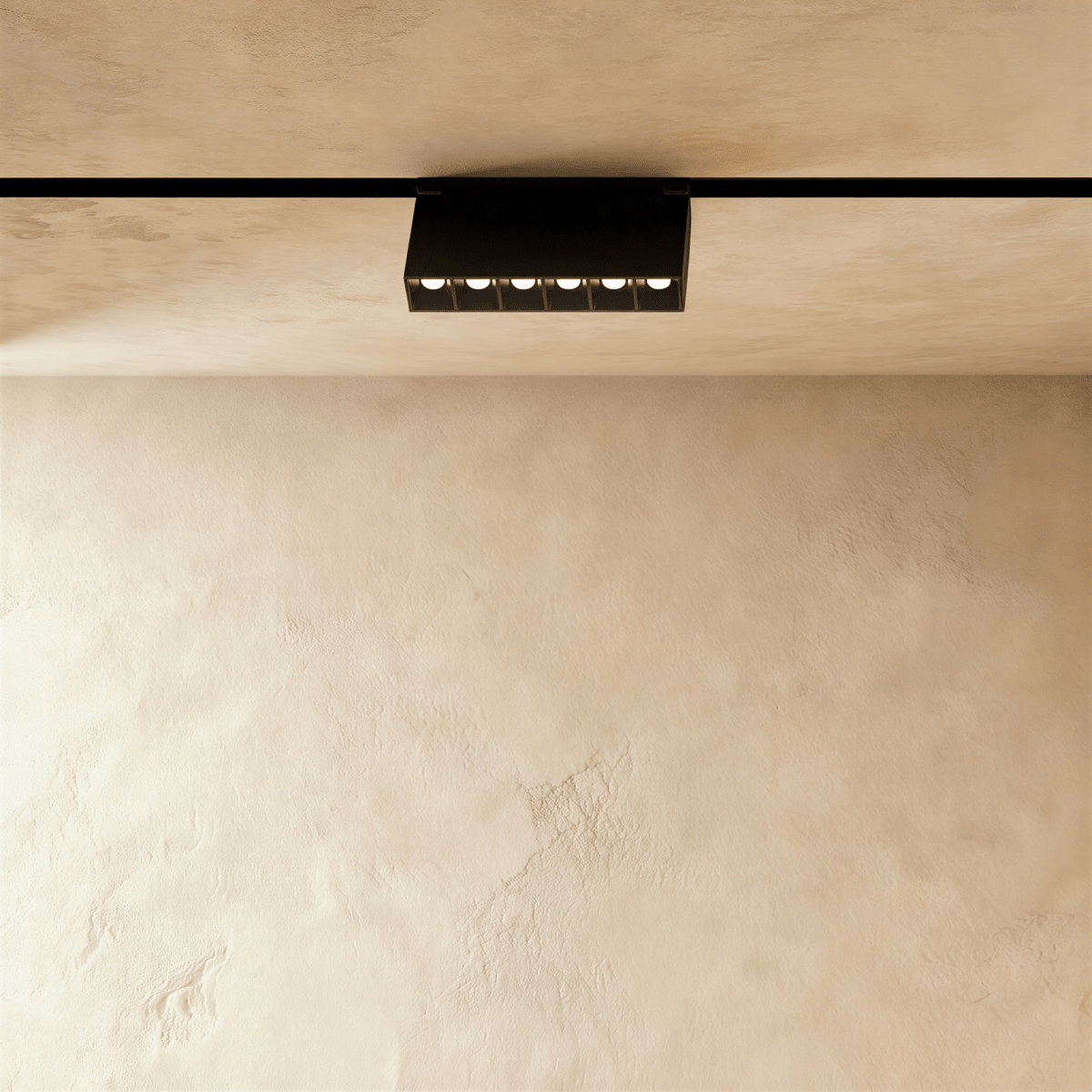 Clérachic surface-mounted grille box seen at an angle, the housing held clear of the ceiling on its bracket.