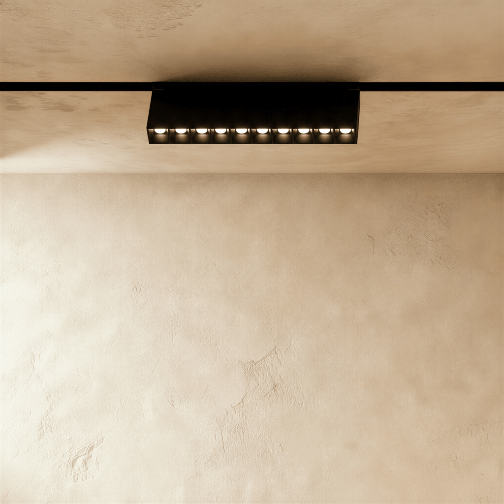 Clérachic surface-mounted grille box in the longer size, ten lit lenses along its underside.