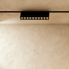 Clérachic surface-mounted grille box in the longer size, ten lit lenses along its underside.