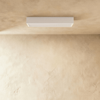Clérachic slim white rectangular surface-mounted ceiling bar light with a frosted diffuser edge, fixed flat to a plaster ceiling.