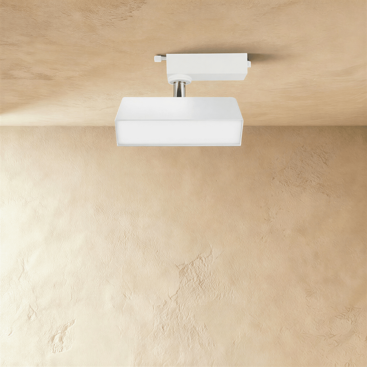 Clérachic short white rectangular track light with a frosted diffuser face, tilting on a chrome stem from a track adaptor.