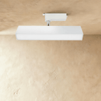 Clérachic medium white rectangular linear track light with a long frosted diffuser, hung from a track adaptor on a chrome stem.