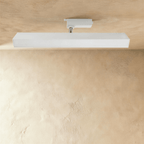 Clérachic long white linear track light with a wide frosted diffuser face, on a white track adaptor and chrome stem.