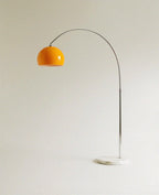 This Clérachic floor lamp pairs a glossy orange dome shade with a slender arc and a round white marble base.