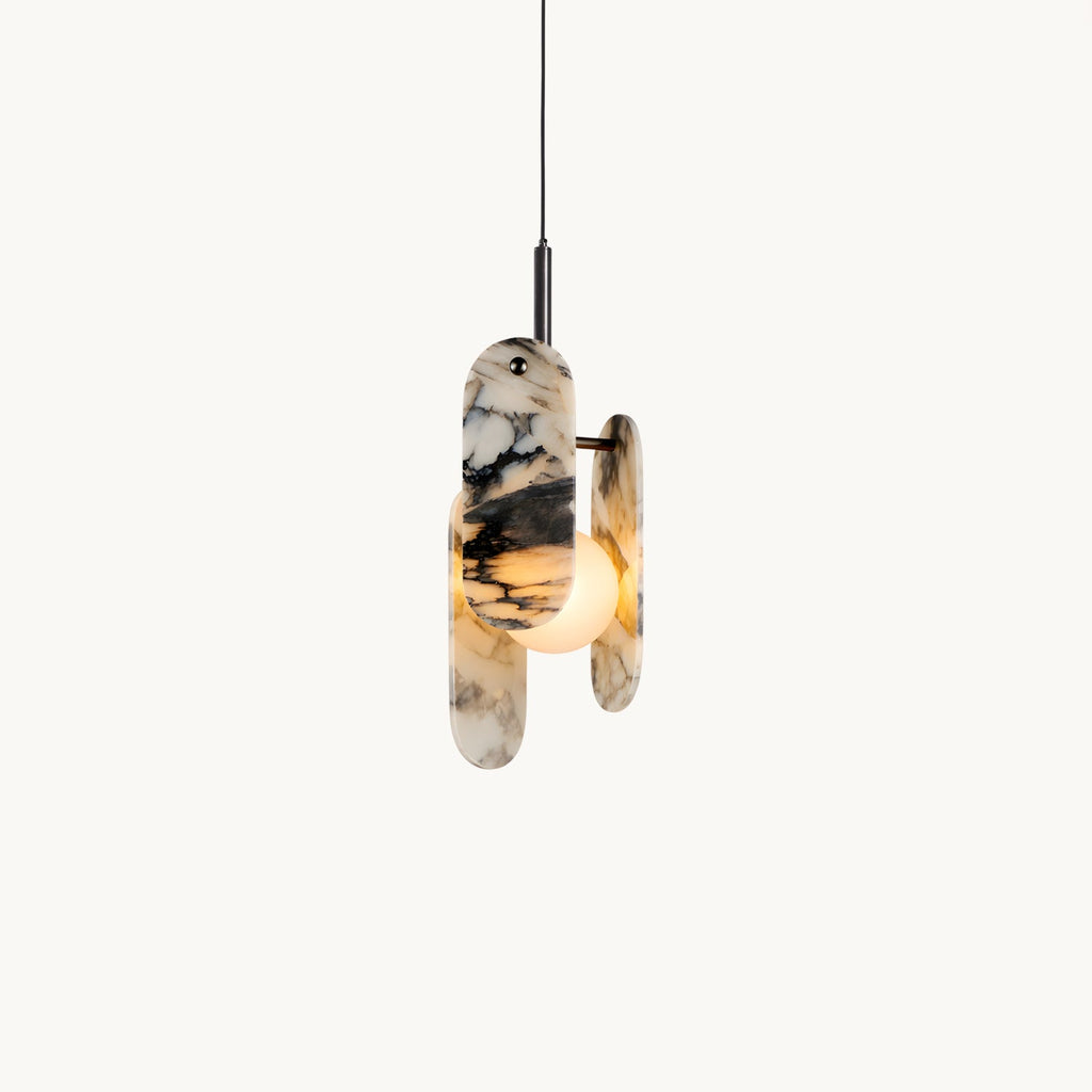 Three oval marble panels with black veining wrap a frosted glass globe on a slim black stem, on a plain white backdrop, from Clérachic.