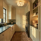 Clérachic stone-slab ceiling light with a brass canopy hanging above a laundry room with cream cabinets and a striped ceiling.