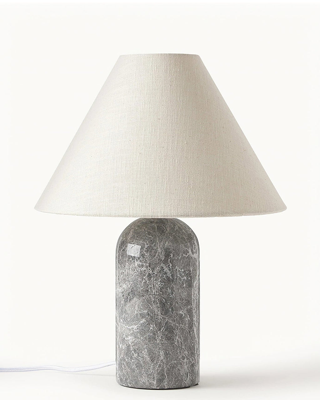 Front view of a Clérachic table lamp with a grey marble base and a wide linen cone shade, on a plain white backdrop.