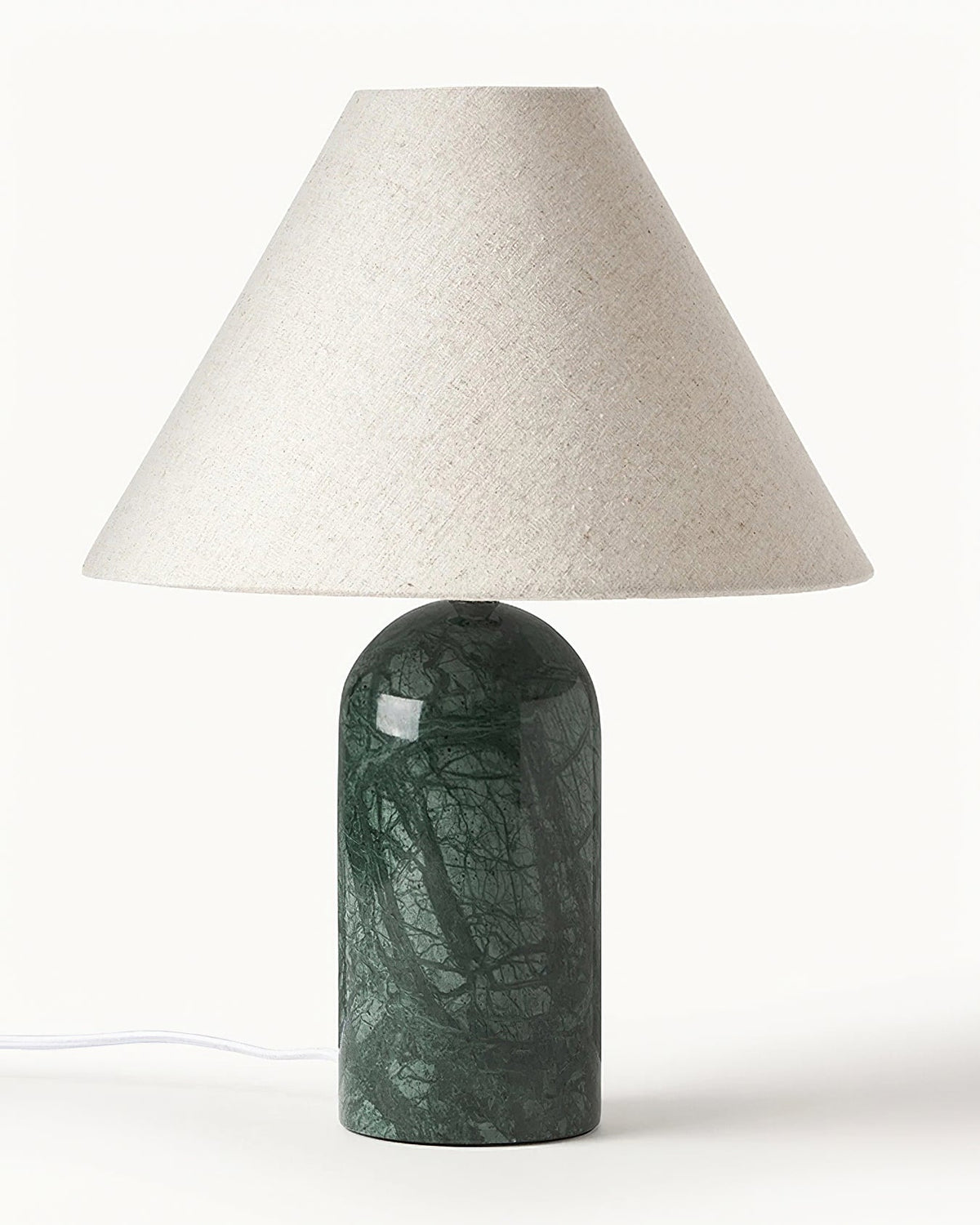 Green marble base with a large linen cone shade, this Clérachic table lamp is shown close up on a white backdrop with its white cord.