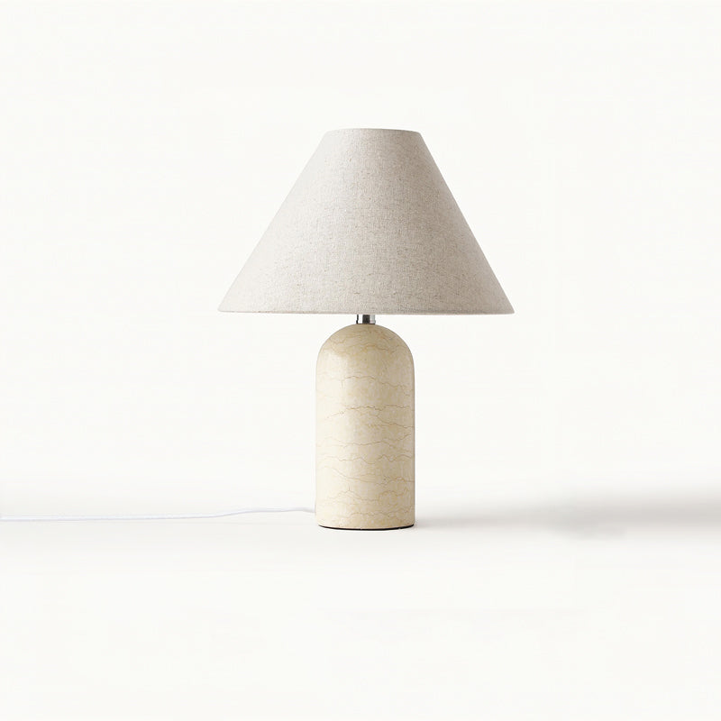 Beige marble table lamp from Clérachic with a natural linen cone shade, photographed on a plain white backdrop.