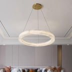 A single Clérachic Marika ring lit above a sofa in a grey panelled room.
