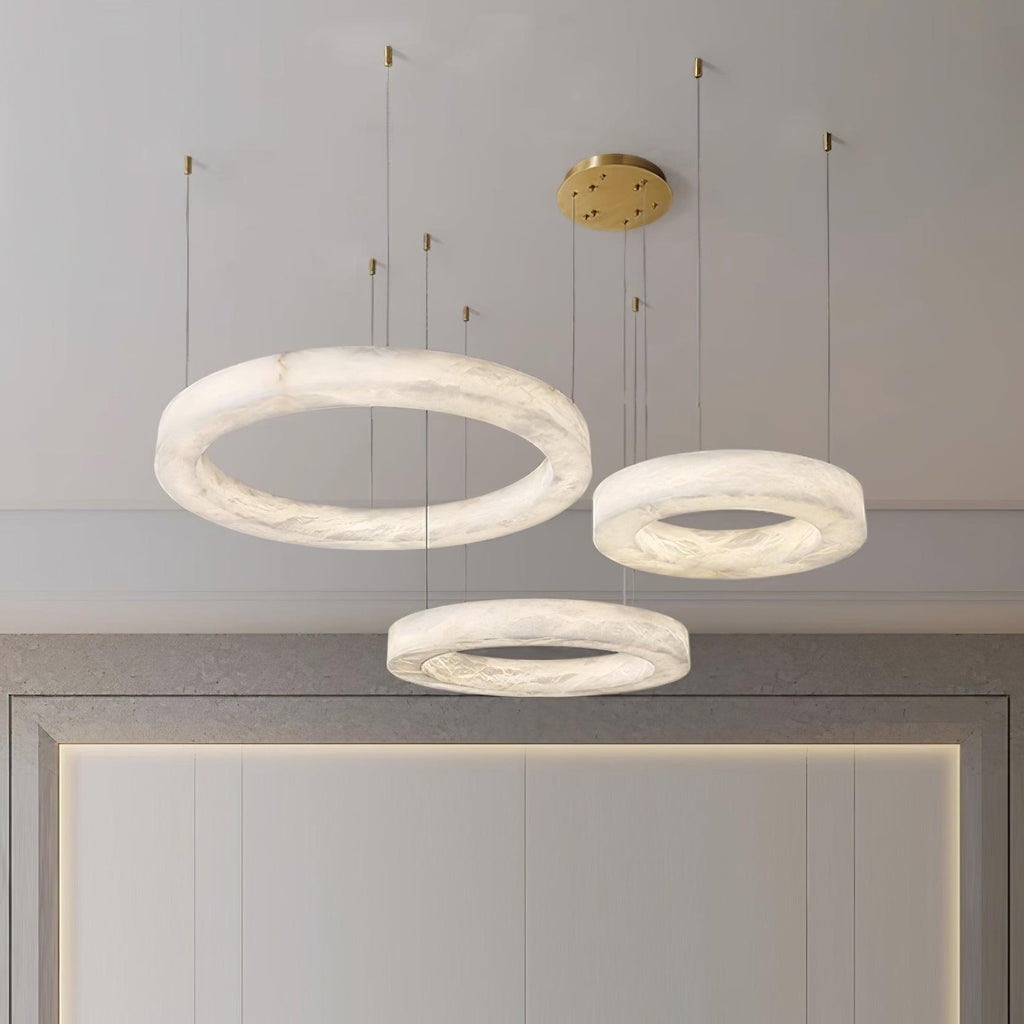 The Clérachic Marika set seen closer above the mirror, stone veining clear in each ring.