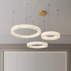 The Clérachic Marika set seen closer above the mirror, stone veining clear in each ring.