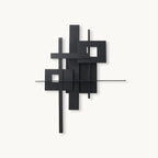 This Clérachic wall light on a plain white backdrop, overlapping matt black rectangles and thin bars with square cutouts.