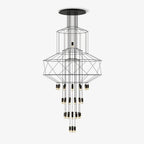 Clérachic wire-frame chandelier with stacked black polygon frames and cylindrical LED drops, hung from a round ceiling plate on a plain white backdrop.