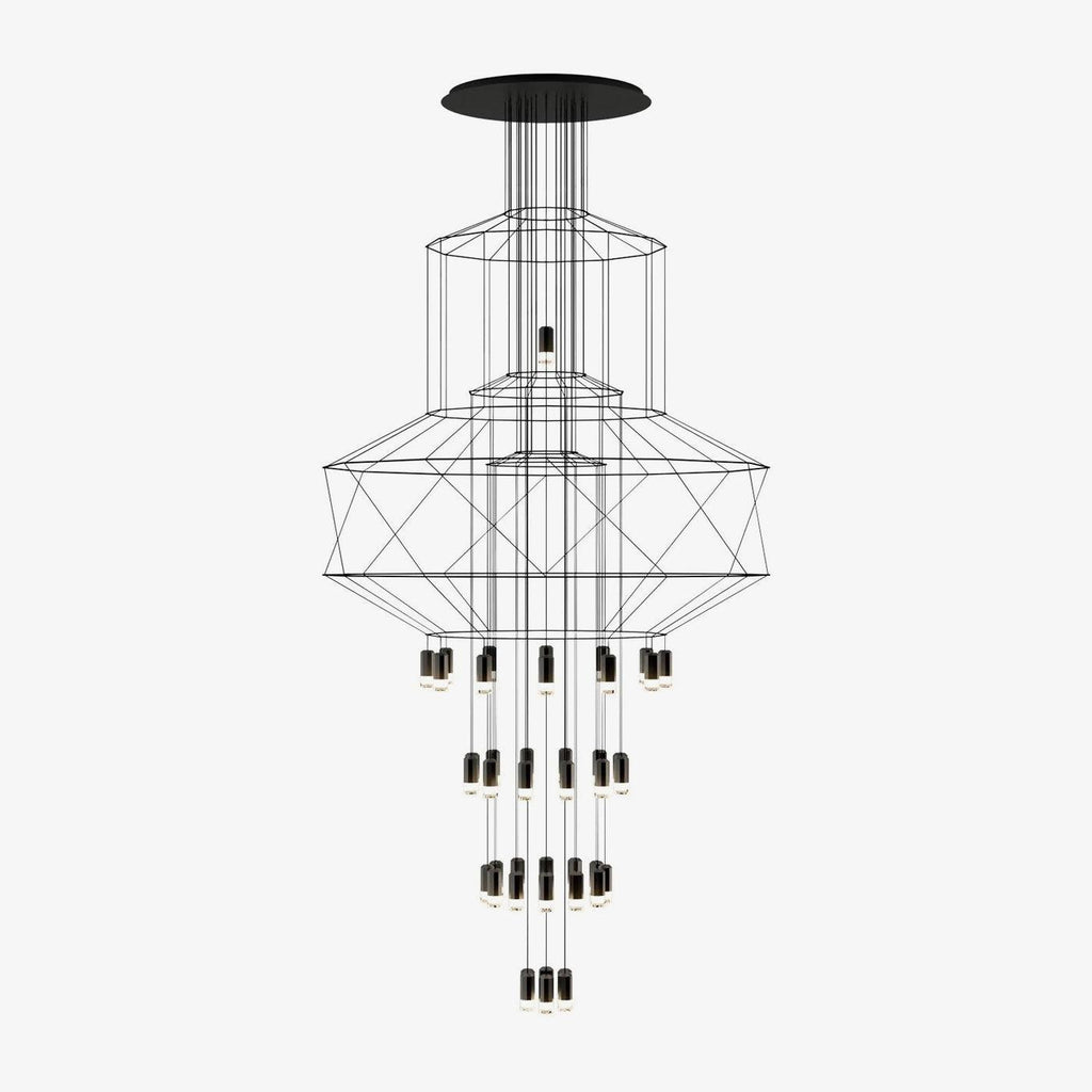 Clérachic wire chandelier with stacked black frames and many LED drops, hanging from a wide round canopy on a pale grey backdrop.