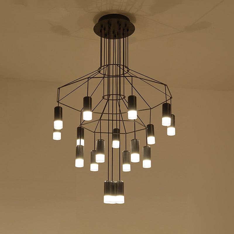 Under-view of a lit Clérachic wire chandelier with two tiers of black frames and about twenty LED drops, on a cream ceiling.