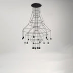 Fine-wire Clérachic chandelier with flared frames and about twenty LED drops, hung from an octagonal ceiling plate on a pale wall.
