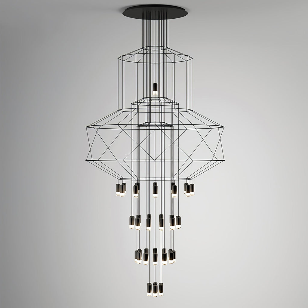 Studio view of the stacked-frame Clérachic wire chandelier with its drops of LED terminals, on a grey backdrop.