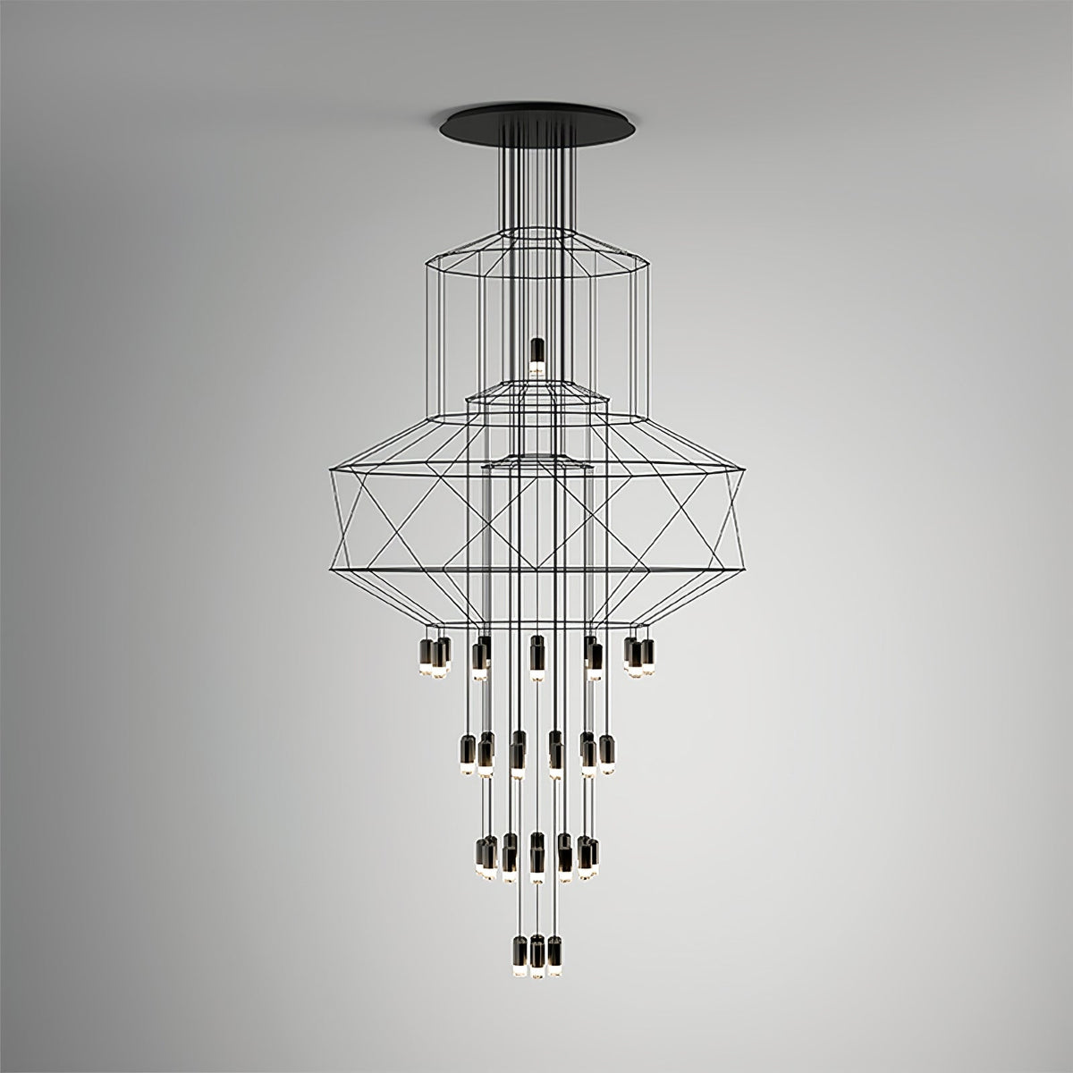 Front view of the Clérachic wire chandelier against a soft grey gradient wall, with LED drops in four tiers.