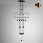 Very long Clérachic wire chandelier with stacked frames, three clusters of drops and a round inset showing two black fittings.