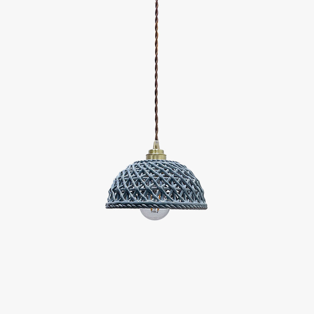Clérachic pendant light in a room setting over a dining table.