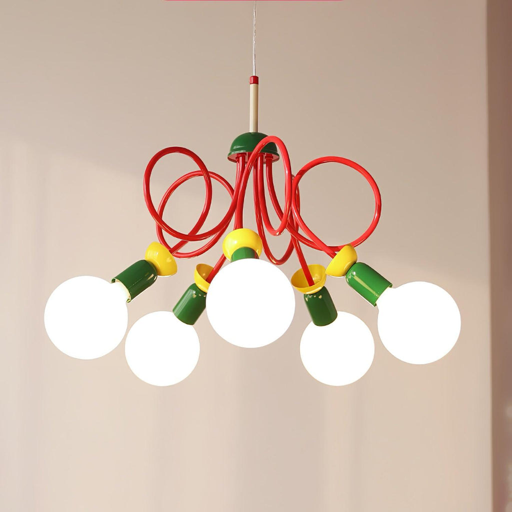 Five glowing globe bulbs fan out from looping red tubes and green sockets on this Clérachic pendant, against a beige wall.