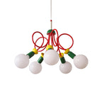 Clérachic pendant with five frosted globes, green sockets and red loops, cut out on a plain white backdrop.