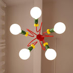 View from directly below this Clérachic pendant, showing five globe bulbs radiating from a red centre on a beige wall.