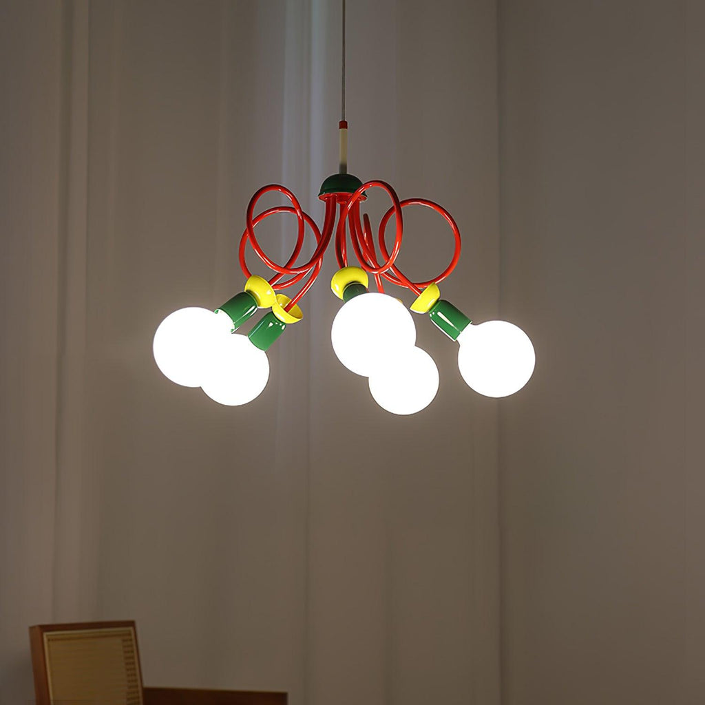 Clérachic pendant switched on in a dim room, its globes glowing and its red loops lit against grey curtains.