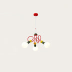 Three-head Clérachic pendant on a red ceiling plate and thin cord, with glowing globes on a plain warm-white backdrop.